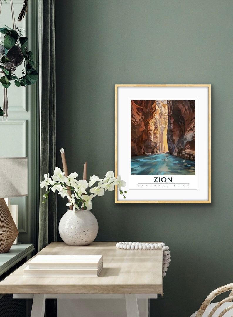May include: A framed print of a canyon with a river running through it. The print is titled "Zion National Park".