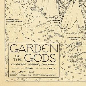 May include: A black and white map of Garden of the Gods in Colorado Springs, Colorado. The map shows trails, roads, and points of interest, including the Visitor and Nature Center, Gray Rock, S. Gateway Rock, Chuckwagon Pavilion, and White Rock. The map is titled "Garden of the Gods" and includes the text "Mapped by Cryptocartography" and the year "2023".