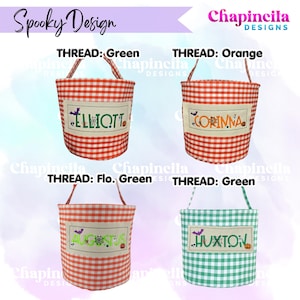 May include: Four fabric buckets with handles, featuring red and white or green and white gingham patterns. Each bucket has a rectangular cream-colored patch with embroidered names: Elliott, Corinna, Augustus, and Huxton, accented with spiderwebs and bats.