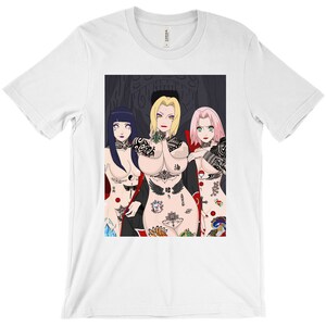 May include: A white t-shirt with a graphic print of three anime characters with tattoos. The characters are a woman with long blonde hair, a woman with long black hair, and a woman with long pink hair. The characters are all wearing revealing clothing and have tattoos all over their bodies.