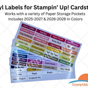 May include: A set of multi-colored vinyl labels for Stampin' Up! cardstock, featuring text for colors from 2025-2027 and 2026-2028. The labels are organized in rows on sheets, with names like Cherry Cobbler, Real Red, and Poppy Parade printed in white.