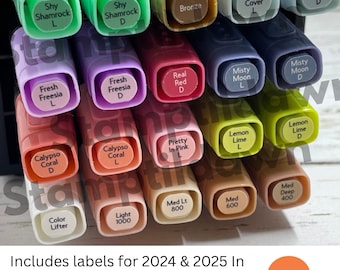 May include: A collection of colorful marker pens with various shades, including green, pink, and purple. Each pen is labeled with its color name. The image includes the text "Includes labels for 2024 & 2025 In Colors - 206 Labels."