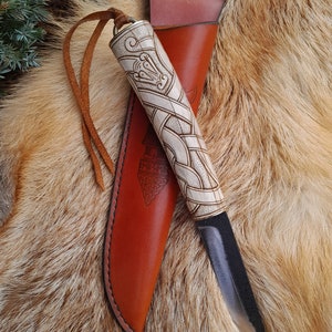 Beautiful Hand-forged Viking knife with leather sheath and hand-carved handle. Dragon knotwork. Norse, Nordic design. Celtic art style.