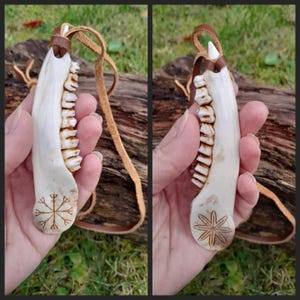 Viking-style pendant showing detailed bone carving