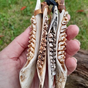 Ancient Norse-inspired pendant carved by hand