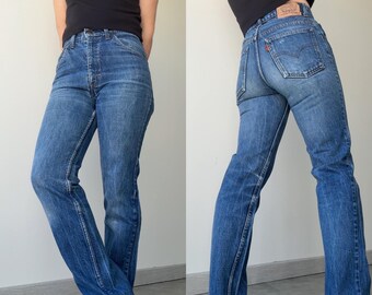 Levi's 631 vintage, talla W27 L30, 26-27 pulgadas (medidas), mezclilla azul oscuro desteñida, etiqueta naranja, años 80/90.