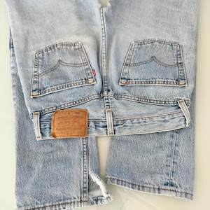 W26 L31 Levis 501 vintage 25-26” waist light blue 501s made in USA for women 90s