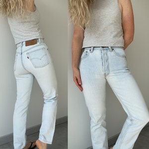 Vintage Levi’s 501 jeans w26 L27  made in USA  1995 light blue faded vintage 501 jeans