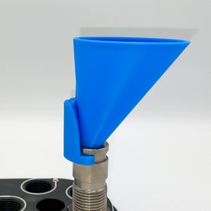 May include: A blue plastic funnel with a metal attachment. The funnel is designed to be used with a small opening.