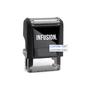 May include: A black self-inking stamp with the word "INFUSION." in white. Below the word "INFUSION." are two lines of text that read "CUSTOM TEXT" in a green box and "CUSTOM TEXT" in a blue box. The stamp is on a white background.
