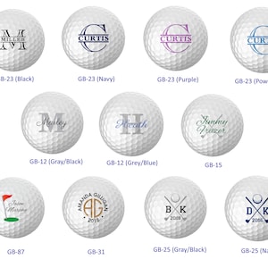May include: A collection of personalized golf balls with various designs and names. The designs include initials, names, and golf-themed graphics. The balls are white with different colored accents.