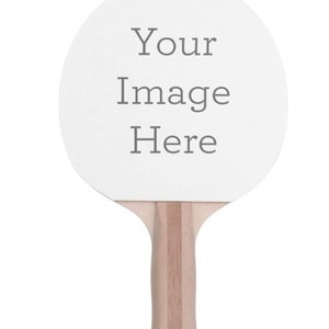 May include: A white ping pong paddle with a wooden handle. The paddle has the text "Your Image Here" printed on it.