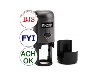 May include: A black self-inking stamp with the word "INFUSION" printed on it. The stamp is next to a black ink pad. Three round stamps are shown below the self-inking stamp. The stamps read "INSPECTED BY BJS", "FYI", and "ACH OK".