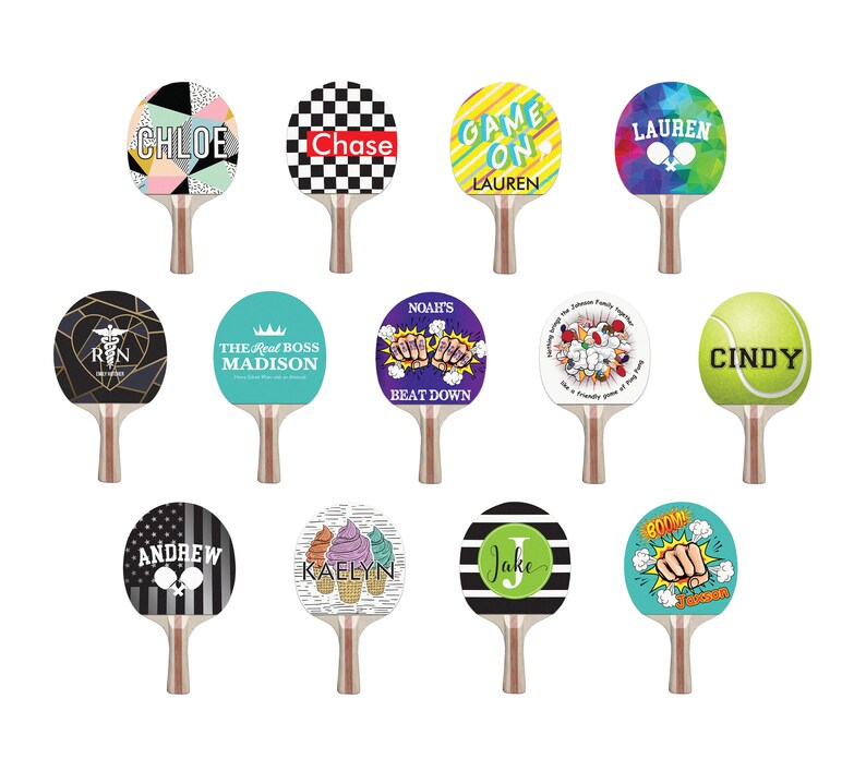 May include: Twelve different designs for table tennis paddles. The designs include names, phrases, and images. Some of the designs include: "Chloe", "Chase", "Game On", "Lauren", "The Real Boss Madison", "Noah's Beat Down", "Cindy", "Andrew", "Kaelyn", "Jake", and "Boom".
