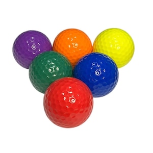 May include: Six golf balls in different colors: purple, green, orange, blue, yellow, and red.