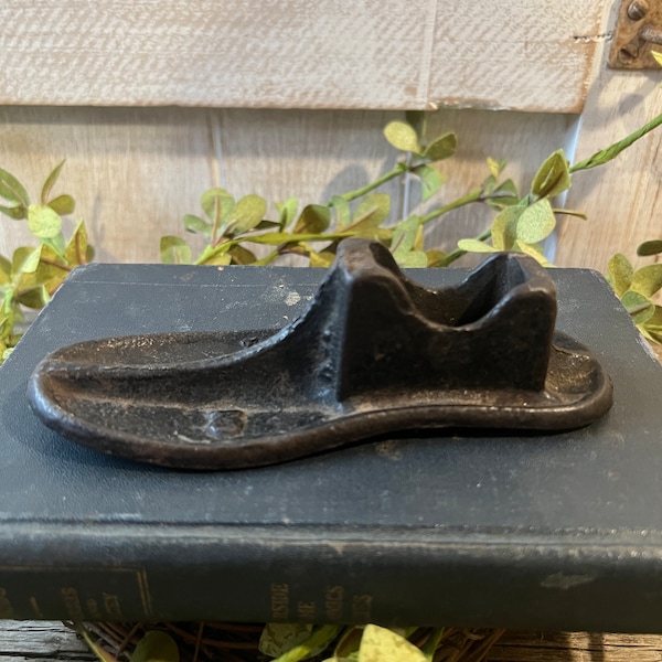 adorable vintage cast iron child size shoe form/ farmhouse decor