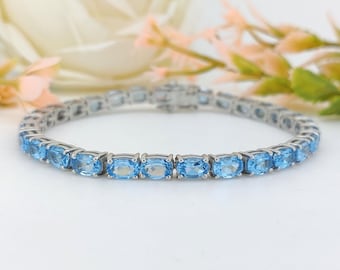 Swiss Blue Topaz Tennis Bracelet: Sterling Silver Oval Gemstone, December Birthstone