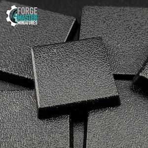 May include: A close-up of several black square plastic bases for miniature figures. The bases have a textured surface.