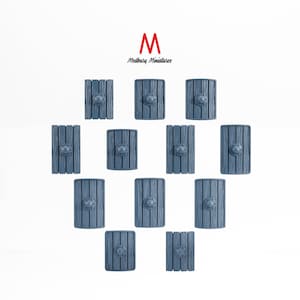 May include: A set of 12 blue and gray wooden shields with a metal boss in the center. The shields are arranged in a heart shape.  Medbury Miniatures.