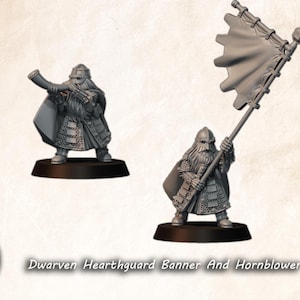 May include: Two gray Dwarven Hearthguard miniatures. One figure blows a horn, the other holds a banner. Both are clad in armor and stand on black bases. The text "Dwarven Hearthguard Banner And Hornblower" is below the figures.