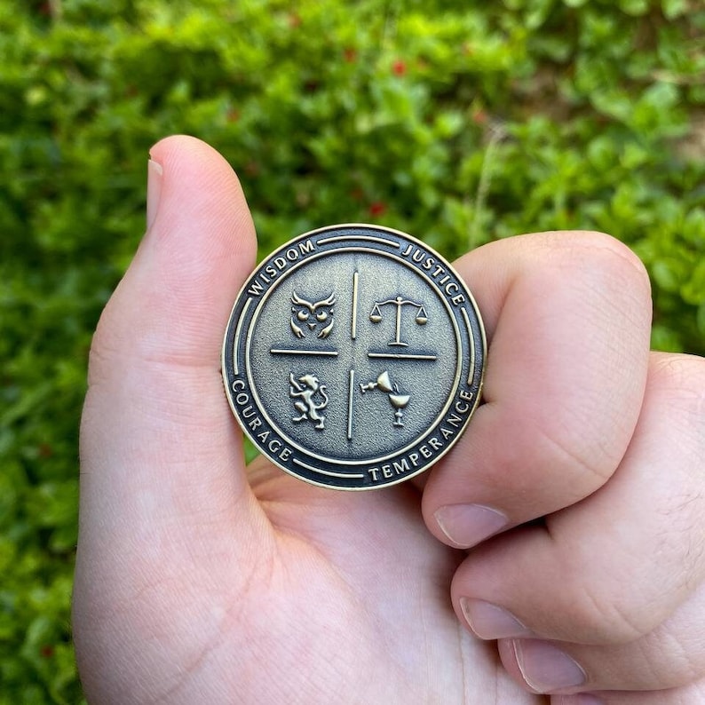 May include: A round, bronze-colored coin with four sections, each featuring a symbol and a word: Wisdom (owl), Justice (scales), Courage (lion), and Temperance (chalice).