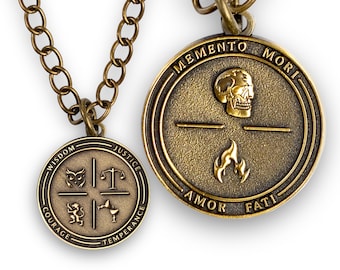 May include: Two bronze-toned circular pendants on a matching chain. The larger pendant features a skull and flame with the text MEMENTO MORI AMOR FATI. The smaller pendant displays an owl, scales, lion, and chalice with WISDOM JUSTICE COURAGE TEMPERANCE.