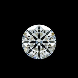 May include: A round, clear diamond with many facets, reflecting light.