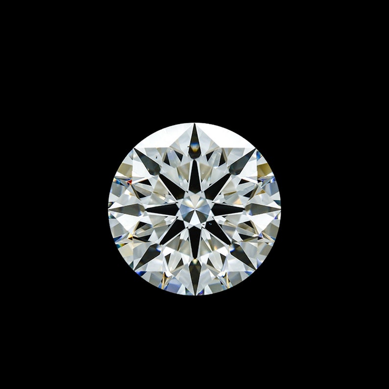 May include: A round, clear diamond with many facets, reflecting light.