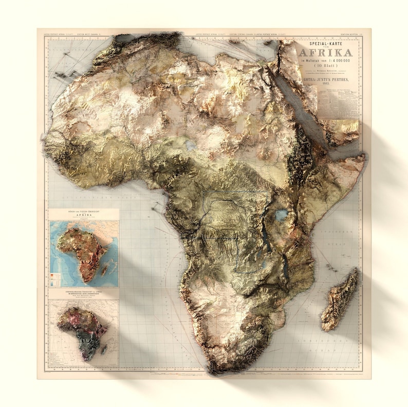 May include: A vintage map of Africa with a 3D embossed effect. The map is printed on a cream-colored paper with a grid pattern. The map shows the continent's physical features, including mountains, rivers, and lakes. The map is titled "AFRIKA" in German.