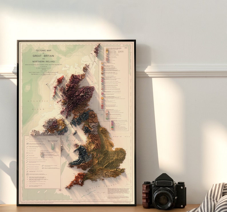 May include: A vintage-style map of Great Britain and Northern Ireland, showing the tectonic plates of the region. The map is printed on a cream-colored paper with a brown border. The map is framed in a black frame.