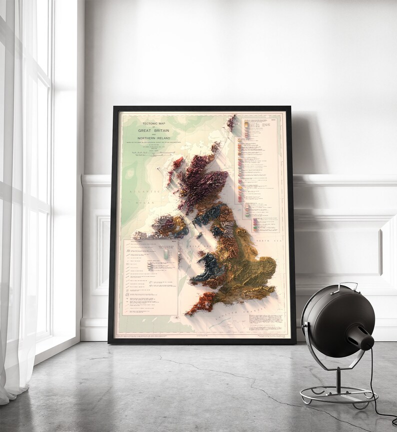May include: A vintage-style tectonic map of Great Britain and Northern Ireland. The map is printed in shades of brown, green, and red, and shows the different geological formations of the islands. The map is framed in black and is hanging on a white wall.