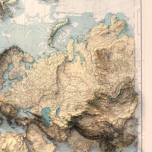 May include: A detailed physical relief map of Eurasia featuring raised topographical textures that highlight mountain ranges and plateaus. The map displays landmasses in shades of beige and tan, with blue water bodies and a grid coordinate system.