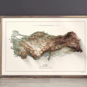 May include: A framed topographic map of Turkey with a 3D embossed effect, showing the country's terrain in shades of green, brown, and white. The map is titled "T&uuml;rkiye Y&uuml;kseklik Haritası".