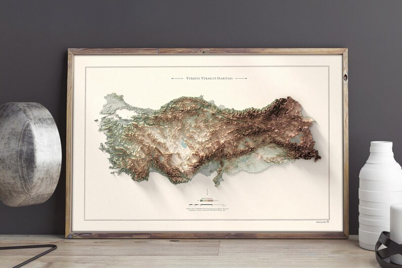 May include: A framed topographic map of Turkey with a 3D embossed effect, showing the country's terrain in shades of green, brown, and white. The map is titled "T&uuml;rkiye Y&uuml;kseklik Haritası".