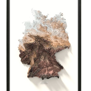 May include: A 3D relief map of Germany with a white background and a black frame. The map is made of paper and has a textured surface. The map shows the different elevations of the country, with the highest elevations being shown in brown and the lowest elevations being shown in white.