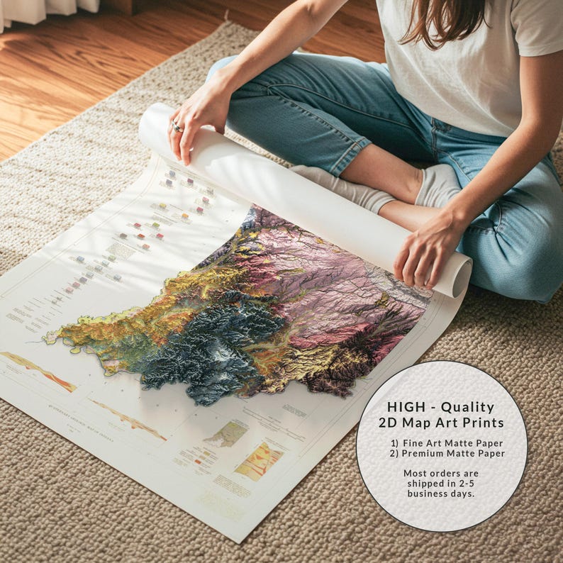 May include: A detailed 2D map art print, with a rolled section and a visible topographical map in shades of green, yellow, blue, and purple. The print is on matte paper. The text on the print reads "HIGH - Quality 2D Map Art Prints".