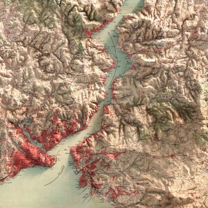 May include: An antique map of a coastal region with a large body of water, likely a bay or inlet. The map is detailed with intricate lines and markings, indicating roads, rivers, and other geographical features. The land is depicted in shades of brown and green, while the water is a light blue. The map is likely from the 19th or early 20th century.