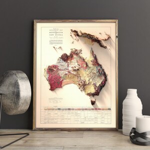 May include: A framed vintage map of Australia and New Guinea with a detailed geological map of the continent. The map is printed in shades of brown, red, and yellow, with a key at the bottom showing the different geological formations.