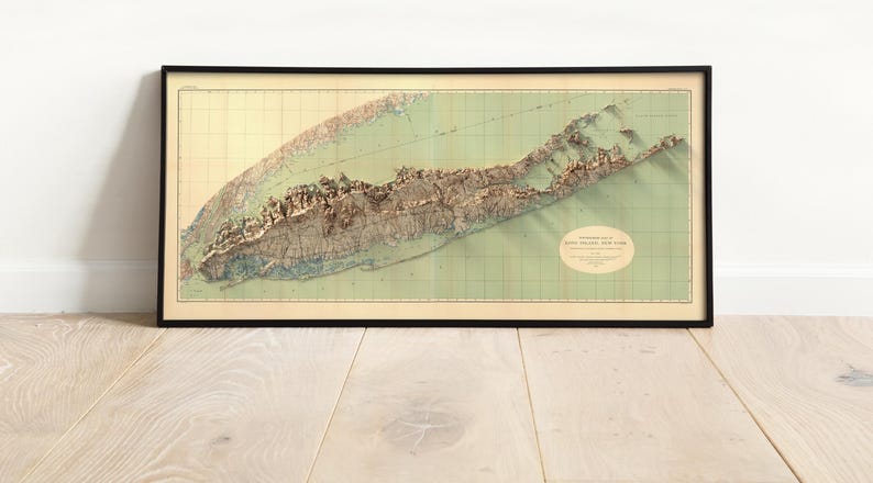 Image of the 1913 Long Island Topographic Map, Framed in a modern living room, blending vintage charm with contemporary decor for a timeless wall art statement.