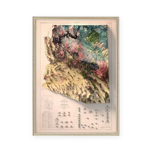 May include: A vintage relief map of Arizona, showing the state's topography in a 3D style. The map is printed in shades of brown, green, and blue, and features a detailed legend with elevation information. The map is framed in a light wood frame.