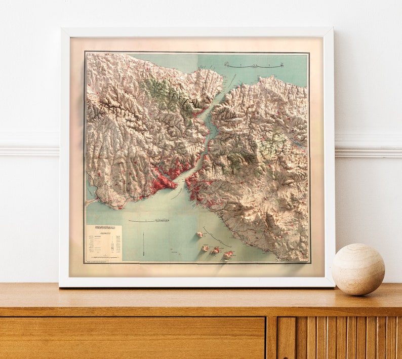 May include: A vintage map of the San Francisco Bay Area, printed in shades of brown, green, and red. The map shows the coastline, islands, and surrounding land. The title "San Francisco Bay" is printed at the top of the map.