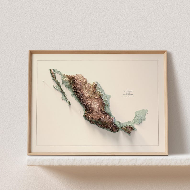May include: A framed 3D relief map of Mexico, showcasing the country's topography in shades of brown and green. The map is set against a cream-colored background and enclosed in a light wooden frame. The text "Elevation Map Mexico" is visible.