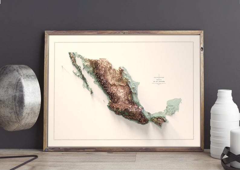 May include: Framed 3D relief map of Mexico, showcasing the country's topography in shades of brown, green, and beige. The map is set against a cream-colored background, enclosed in a wooden frame. The map is labeled with the country's name.
