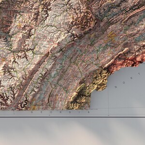 May include: A detailed topographic map of the state of Virginia, showing the Appalachian Mountains and the Blue Ridge Mountains. The map is in shades of brown, green, and blue, with the names of some cities and towns labeled.