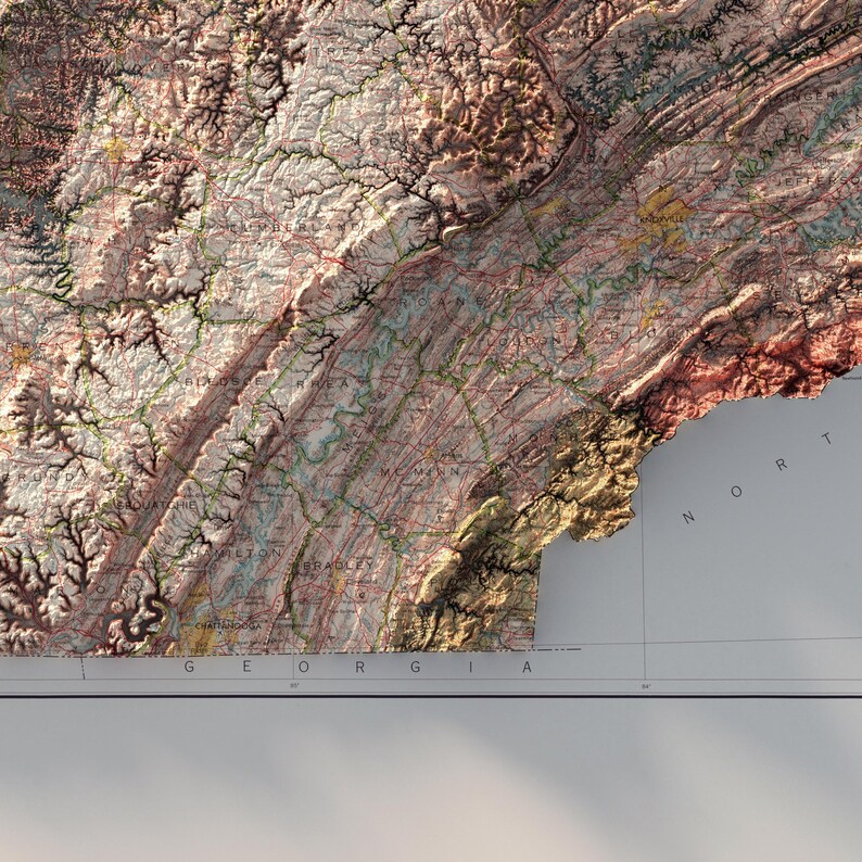 May include: A detailed topographic map of the state of Virginia, showing the Appalachian Mountains and the Blue Ridge Mountains. The map is in shades of brown, green, and blue, with the names of some cities and towns labeled.