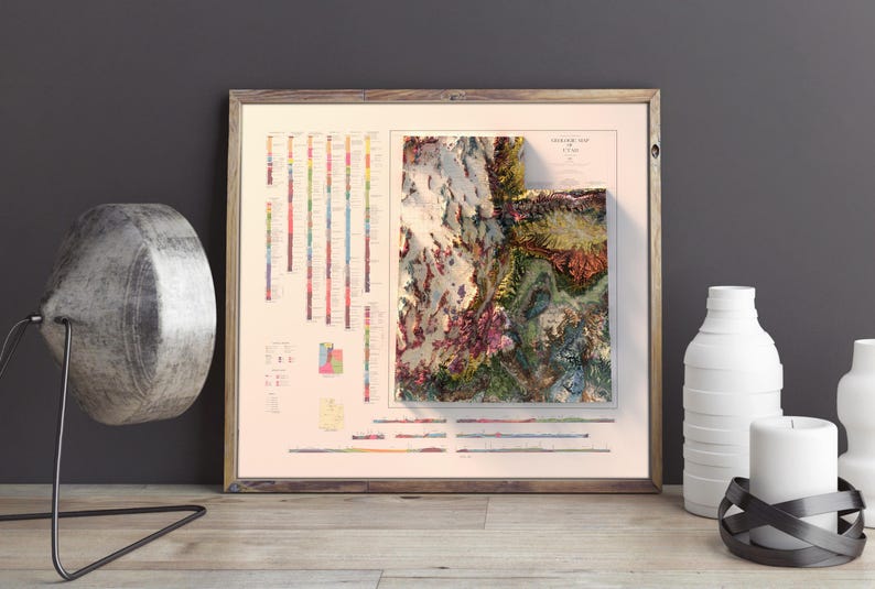 May include: A framed print of a topographic map of Utah, with a colorful geological timeline on the side. The map shows the state's varied terrain in shades of green, brown, and red.