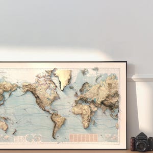 May include: A framed world map print featuring a three-dimensional relief effect. The landmasses are rendered in shades of gold and tan, contrasting against a light blue ocean background with thin, dark blue contour lines across the entire surface.