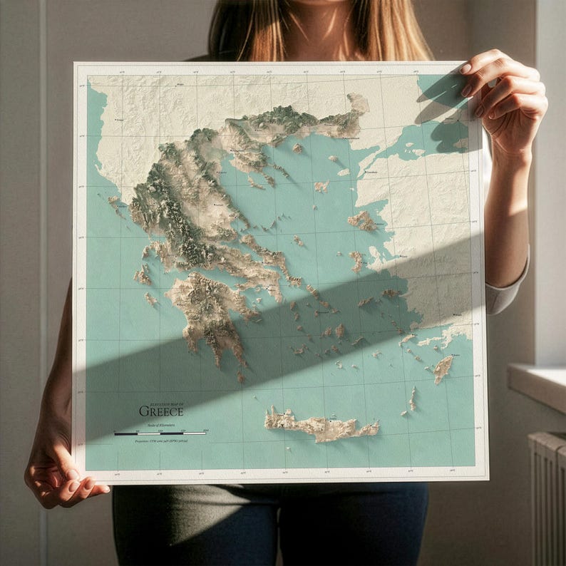 May include: A square wall map of Greece featuring a three-dimensional relief design with a light teal ocean background and beige landmasses. The map includes a grid overlay, the text GREECE, and a scale bar in kilometers at the bottom left corner.