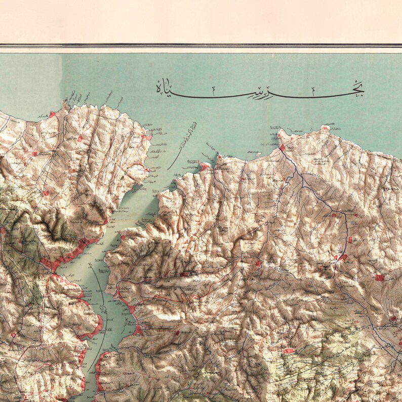 May include: A detailed map of a mountainous region with a large body of water in the center. The map is drawn in a vintage style with brown, blue, and red lines and text. The text is in Arabic.