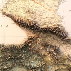 May include: A vintage map of the Caucasus region, showing the borders of Russia, Turkey, and Persia. The map is detailed and includes mountains, rivers, and cities. The map is printed on a cream-colored paper with brown and red lines.